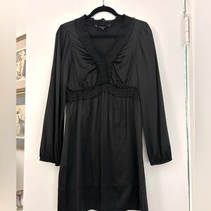 BCBG black satin party dress in great condition. A-line w/ruching throughout.